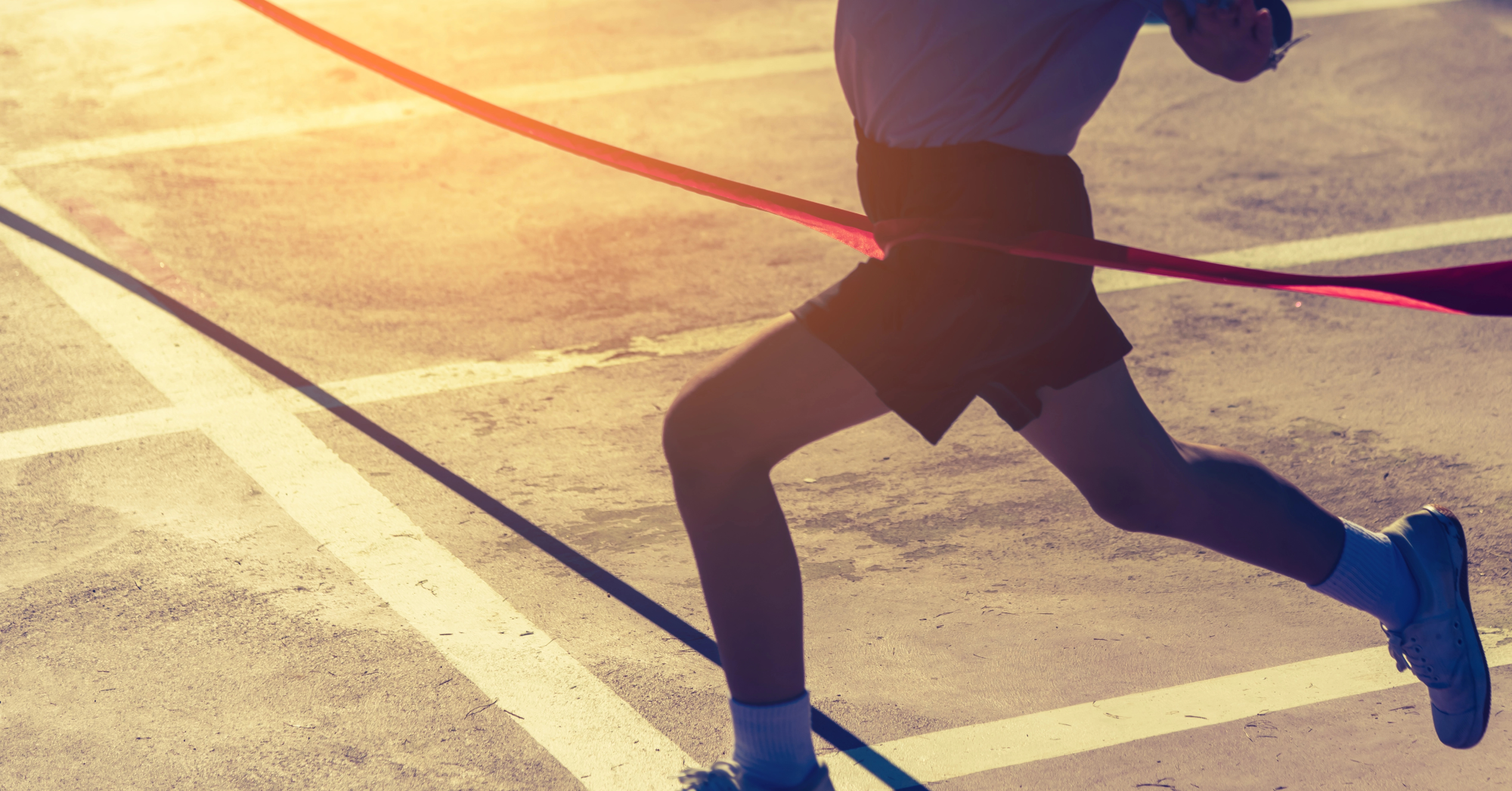 runner reaching the finish line