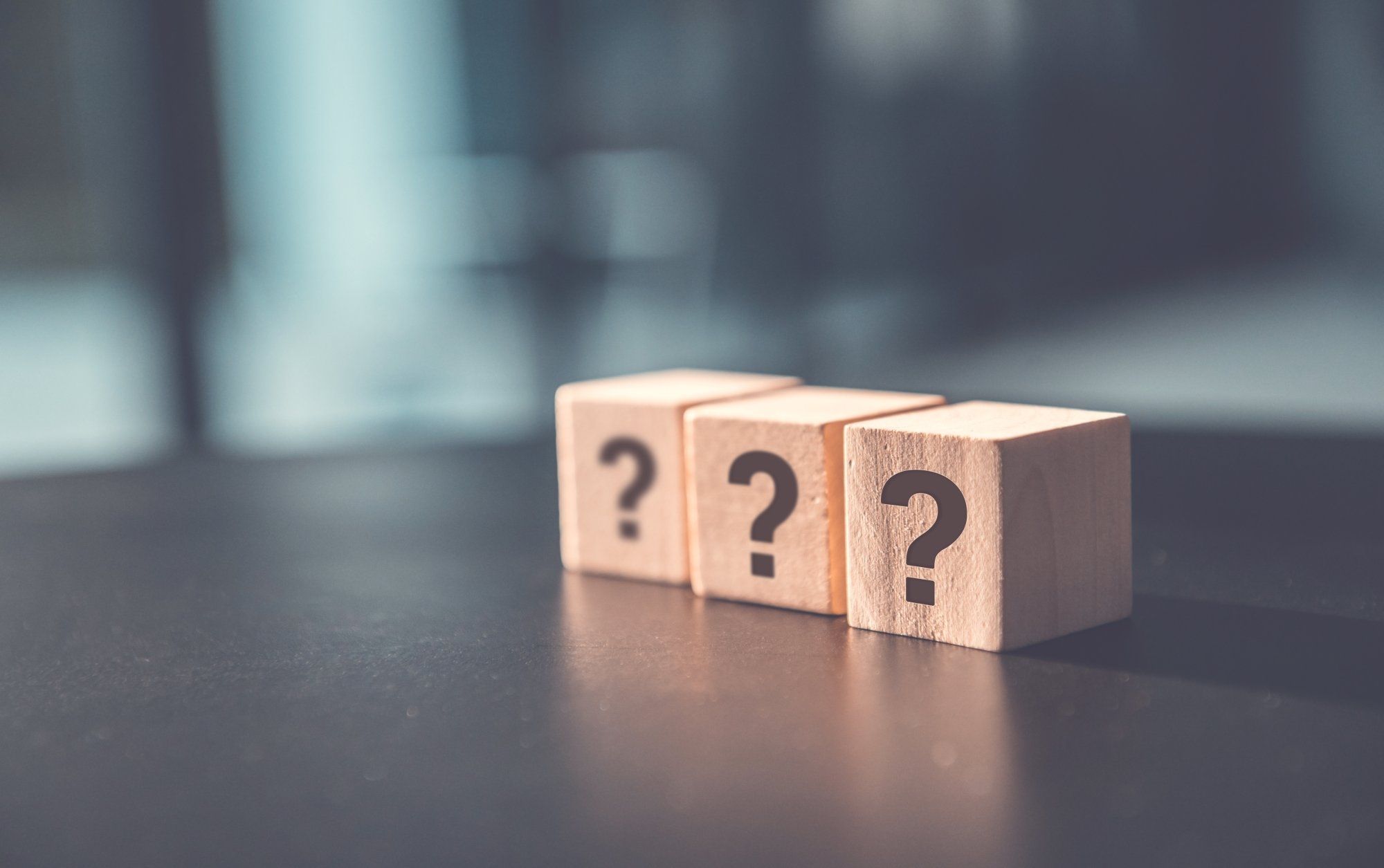 questions-answers-dqs-question mark on wooden dice on table