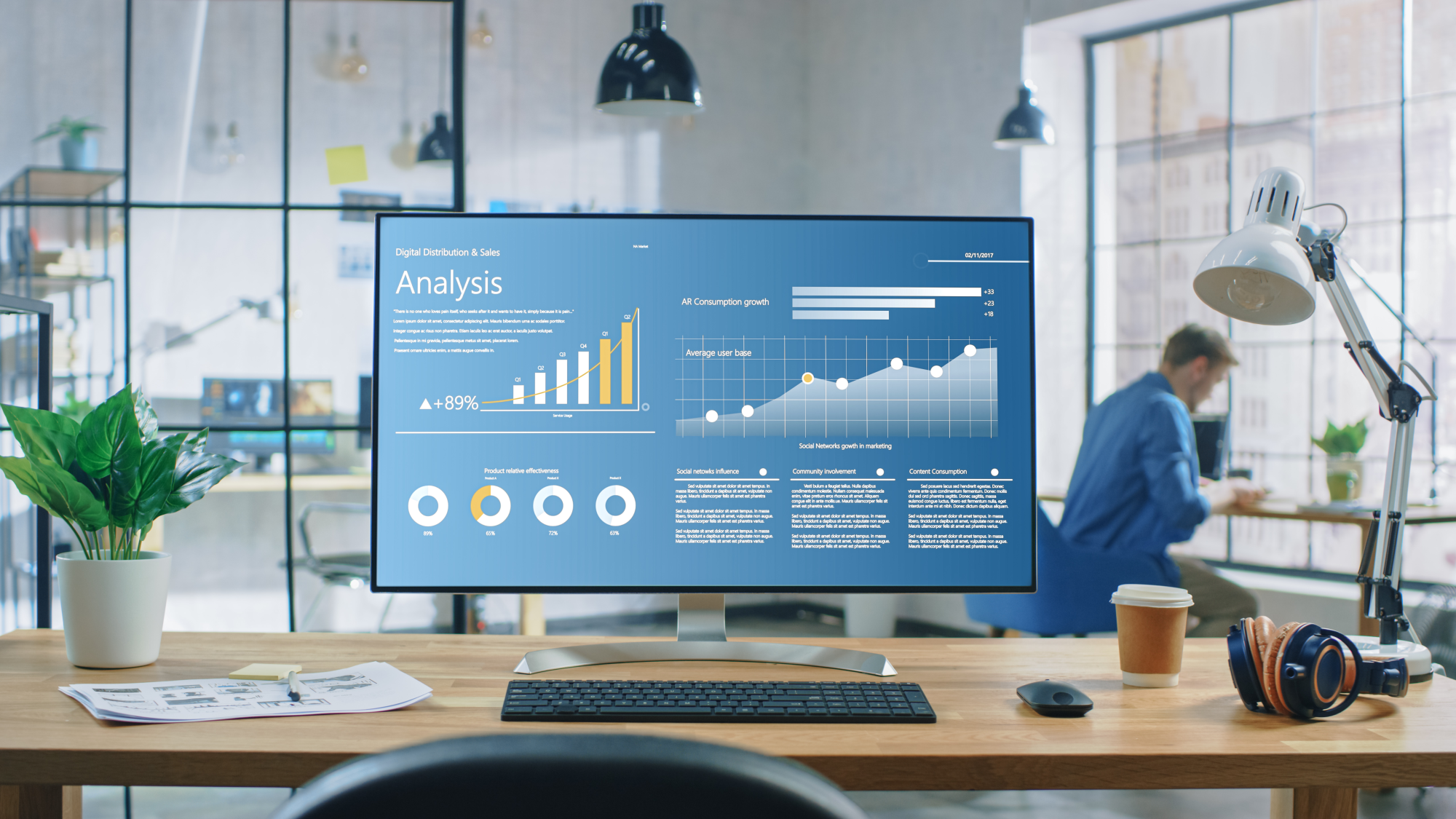it-security-vs-information-security-dqs-modern office space with large monitor displaying analytics