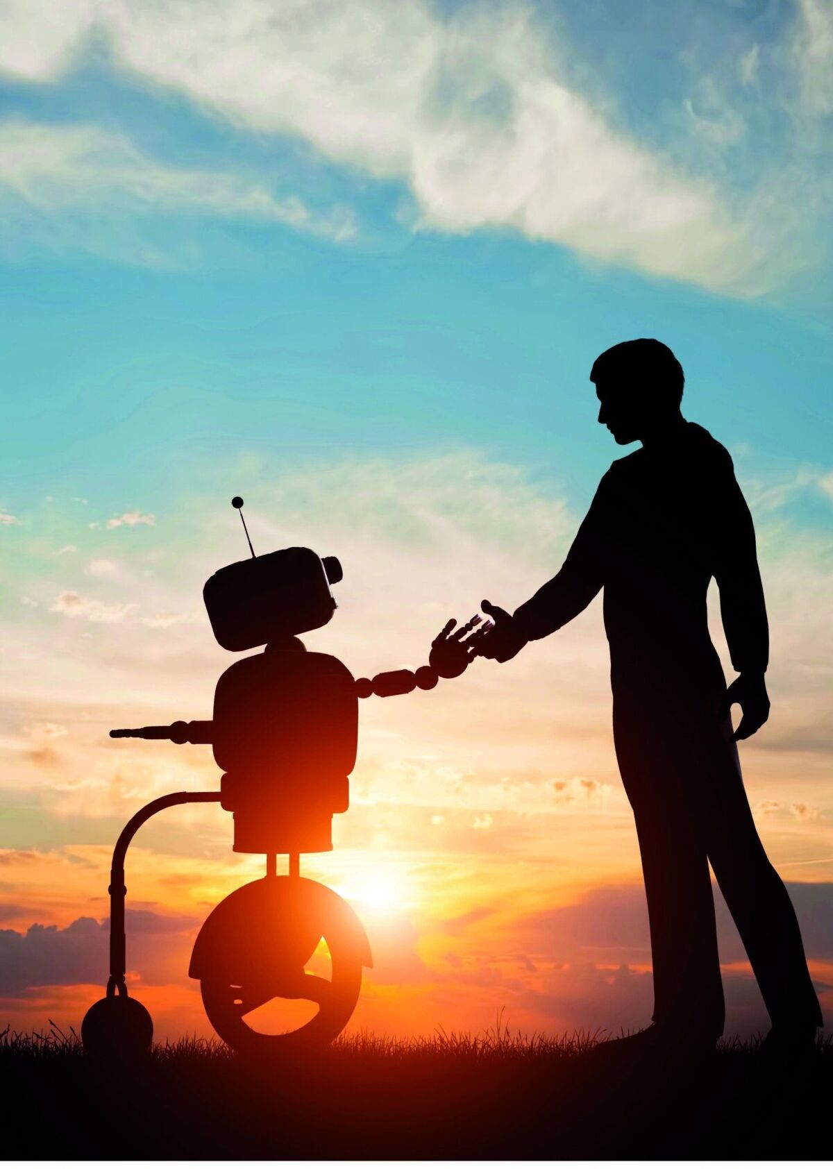 full picture of robot holding hands with a human in the sunset