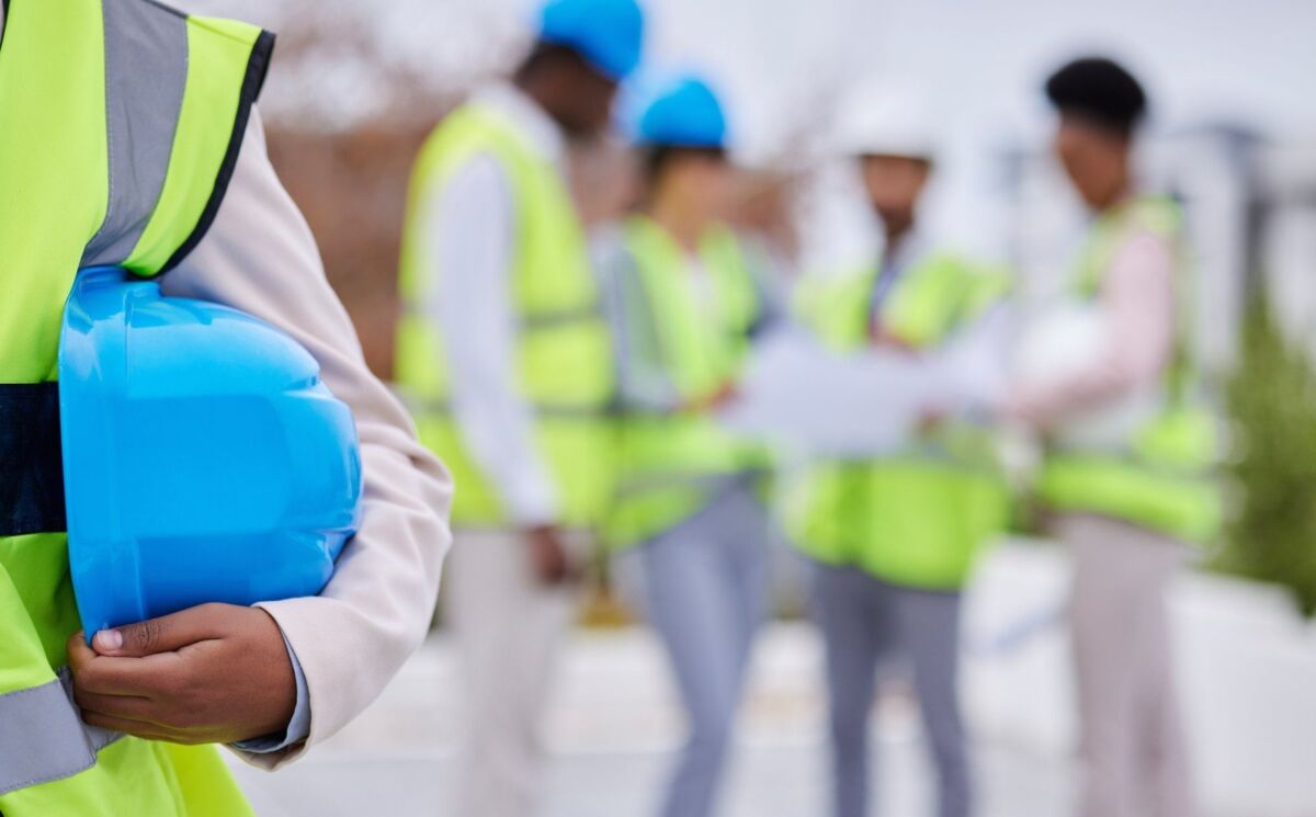 Construction, building and team of engineers on site for creative planning with a blurred background