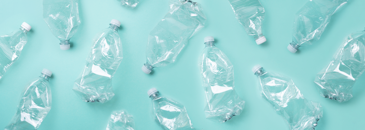 dqs-empty used plastic bottles on blue background