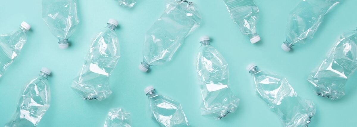 dqs-empty used plastic bottles on blue background