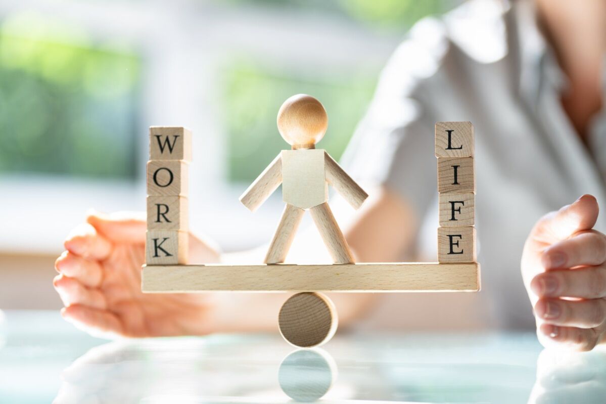 work-life-balance-dqs-wooden blocks work and life on a seesaw in balance
