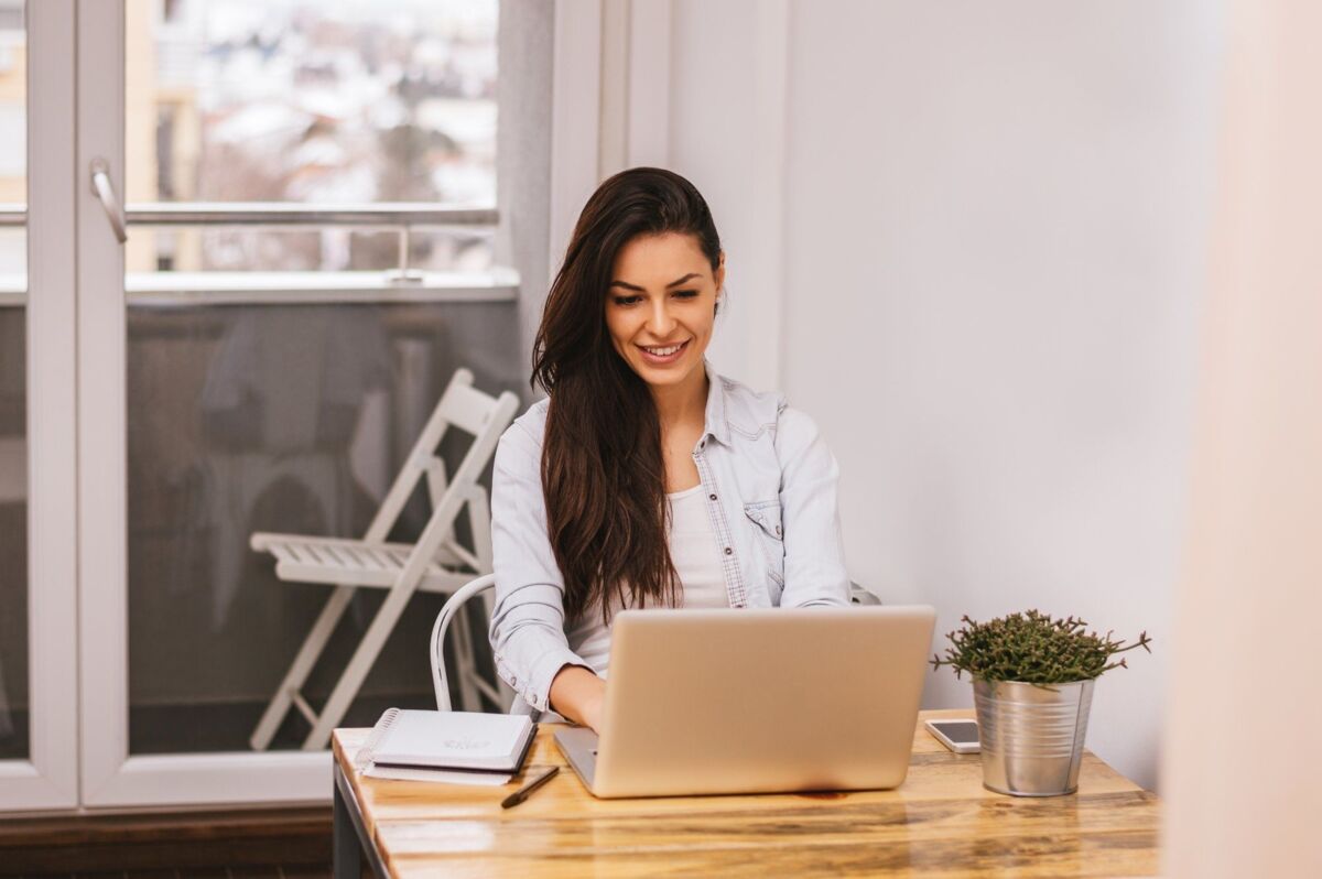 Beautiful woman using laptop at home