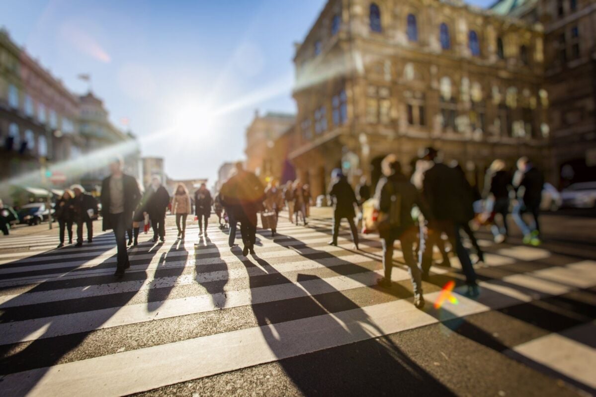 header-home-dqs-pedestrians cross the street