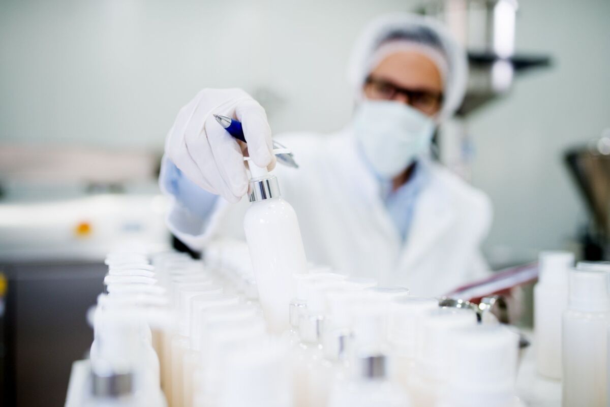 Healthcare industry. Creme production. Working in laboratory with special equipment.