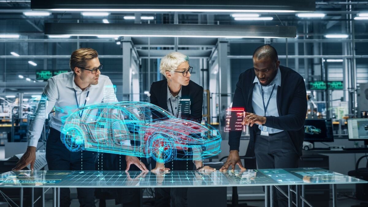 iatf-16949-certification-dqs-three engineers working on a virtual 3d model of a car