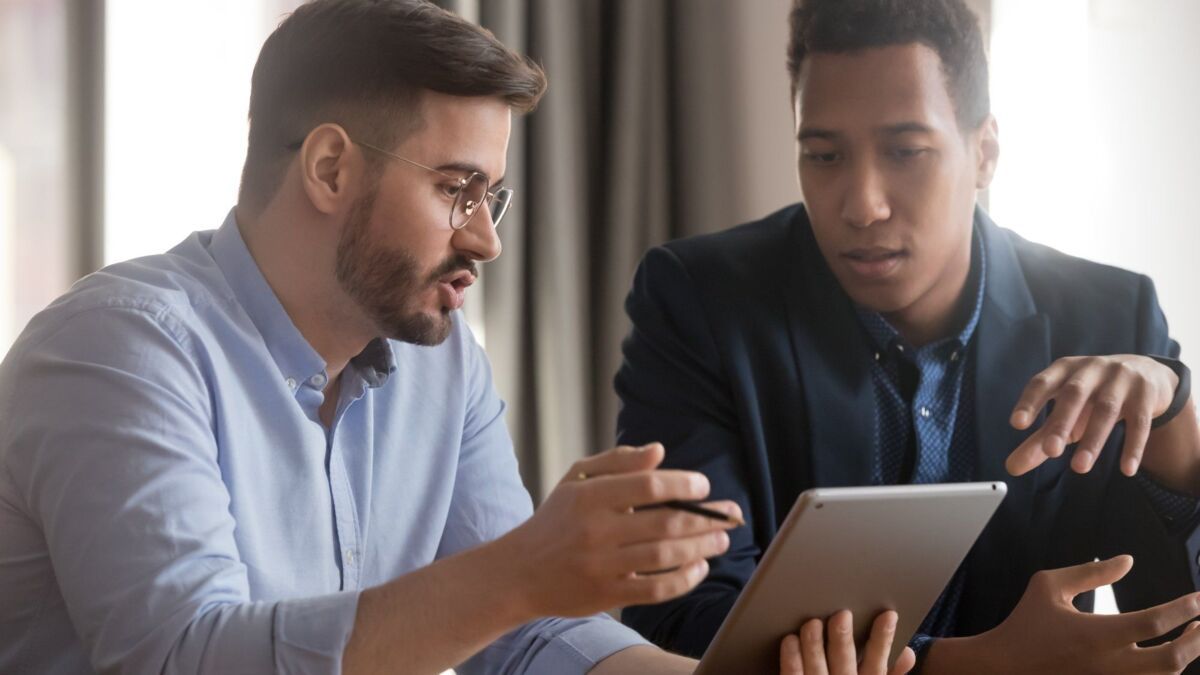 certify-about-dqs-two businessmen talking to each other