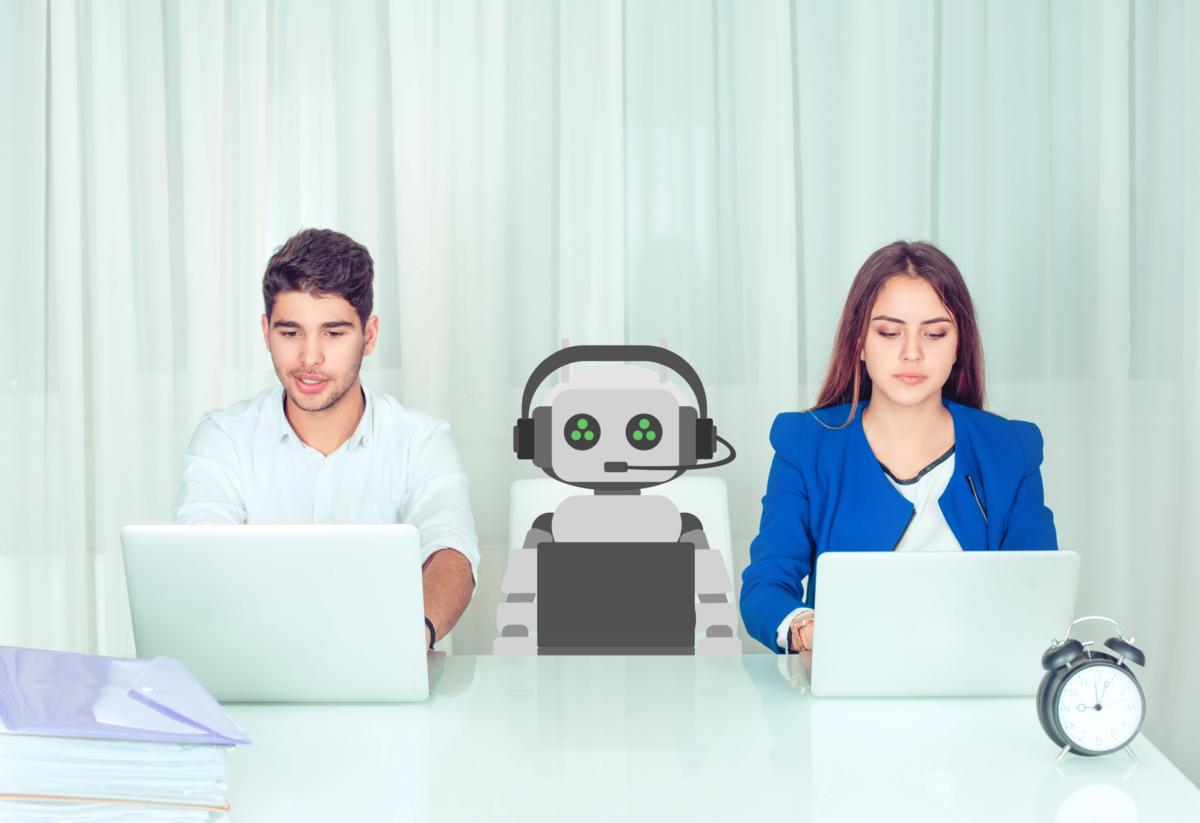 man and woman with robot sitting at table in office to symbolize working with AI