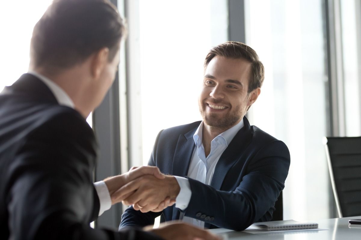 Two business men shaking hands