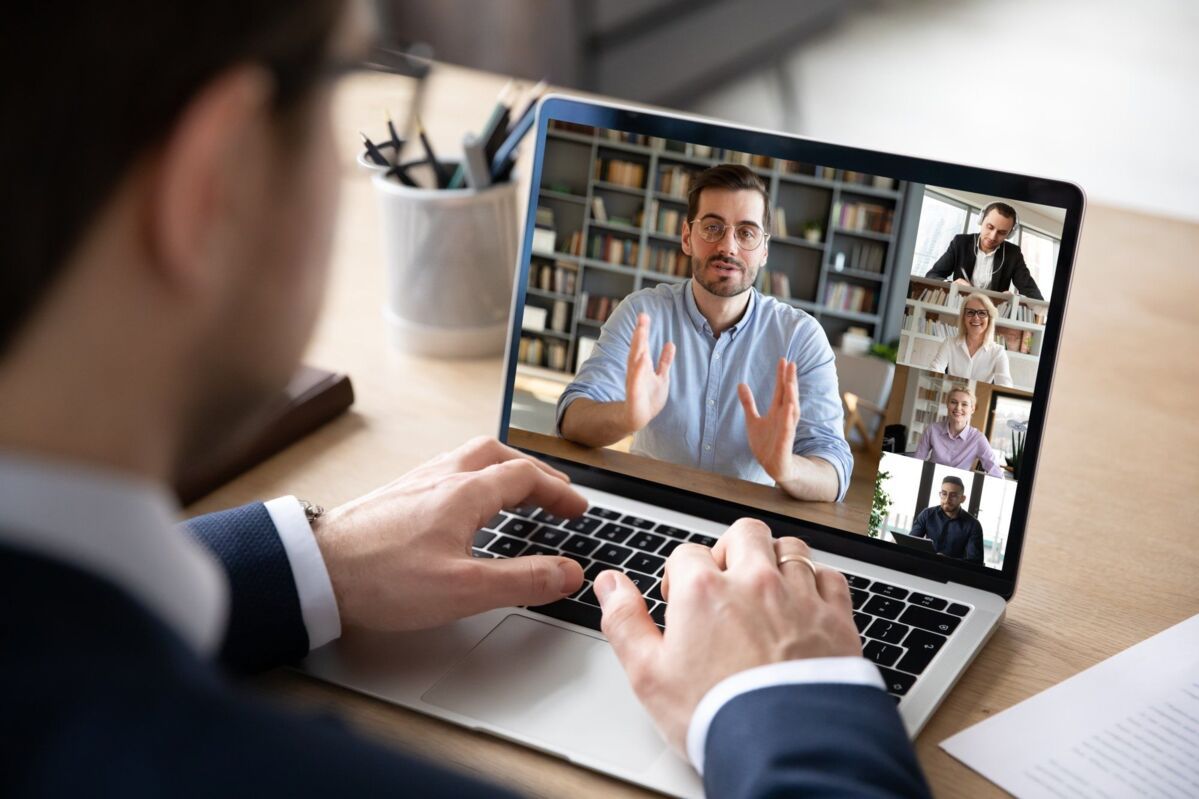 IATF-Remote-Audit-dqs-diverse business people involved in group videocall conversation discuss commo