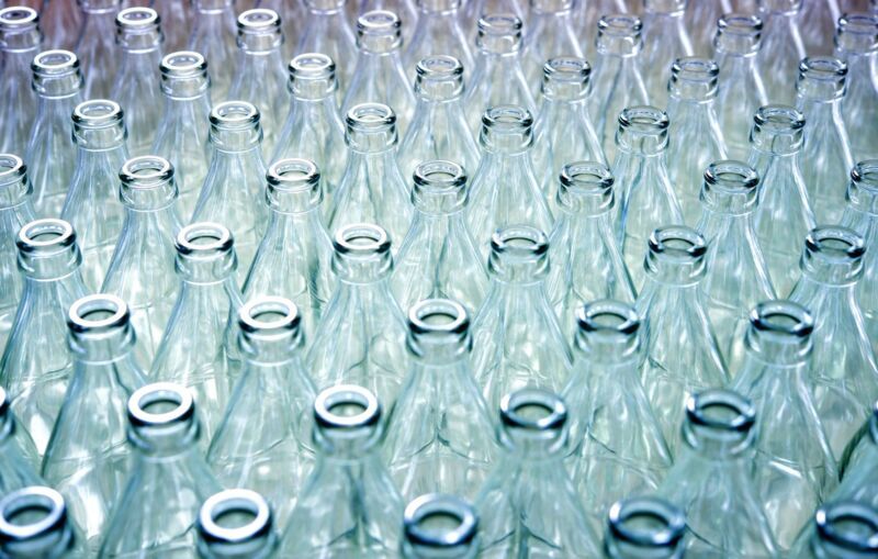 Empty glass bottles in factory to fill with drink