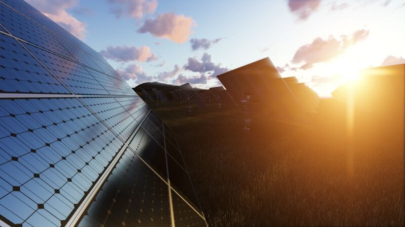iso-50005-implement-energy-management-dqs-solar panels field at sunset