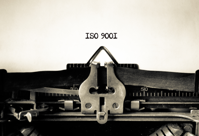 history-iso-9001-dqs typewriter transmits the term iso 9001