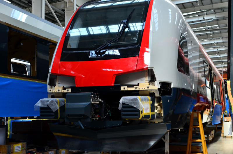 iso-ts22163-iris-certification-dqs-modern passenger elevator on an assembly line